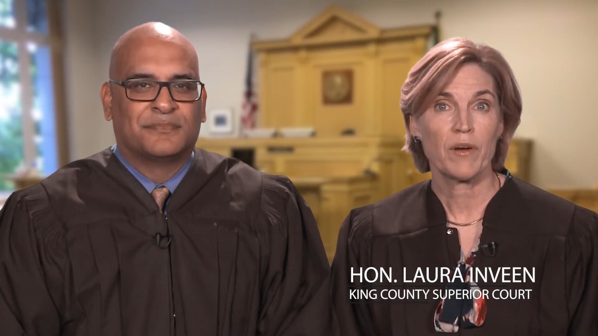 Judge Ketu Shah and Judge Laura Inveen sitting in a courtroom.